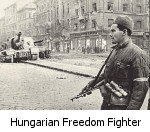 A Hungarian Freedom Fighter keeps watch on the streets of Budapest in 1956