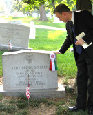Bryan Dawson-Szilagyi, AHF Executive Committee Chair, placing placing the AHF commemorative ribbon on the grave of Capt. Akos Szekely who died a hero's death in Vietnam.