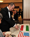 Embassy Chef Viktor Merényi presented his famed Hungarian "Dobos Torta" (Dobos Cakes) draped in the flags of the United States and Hungary. Chef Merényi won the Challenge Sweden competition at the 2010 Embassy Chef Challenge held at the House of Sweden on March 18, 2010