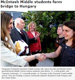 His vision was to create “Classrooms of the Future,” building Educational Bridges between the US and Hungary and Promoting Science Education. Seen here are Hungarian Parliament members Katalin Somfai, left, Janos Horvath and Monika Bartos greet McIntosh Middle School science students John Morris, 12, a sixth-grader, and Yasmeen Arslanagic, 12, a seventh-grader, at the Sarasota County middle school. They are creating a science community between students in both Hungary and the United States.