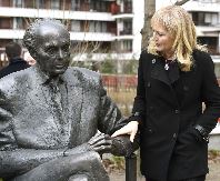 One of the daughters of the politician Katrina Lantos Swett touches the statue of her father, late US Congressman of Hungarian origin Tom Lantos during the unveiling ceremony near Lantos’ former school, Berzsenyi Daniel Secondary School, in Tom Lantos Walk in Budapest, Hungary, Thursday, Feb. 1, 2018. (Noemi Bruzak/MTI via AP) (Associated Press)