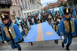Hungarians carry the Szekely flag in Transylvania