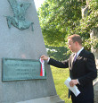 Bryan Dawson-Szilagyi places the AHF commemorative ribbon on the Gravesite of Gen. Julius Stahel, US Civil War hero and Congressional Medal of Honor Winner