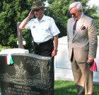Hungarian Military Attache Col. Janos Varga salutes Gen. Alexander Asboth with AHF Assoc. President Dr. Imre L. Toth after placing the AHF commemorative ribbon on Memorial Day 2006