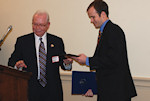 Zoltan Bagdy presents Congressman Dan Lipinski's Chief of Staff with a plaque thanking him for his support