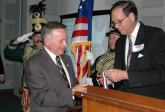Frank Koszorus presents Cong. Tom Tancredo with AHF's Col. Commandant Michael Kovats Medal of Freedom